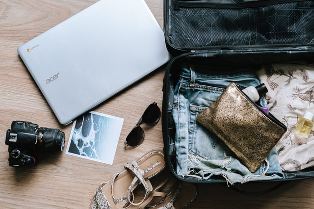 woman packing suitcase, How to Move Abroad in Your Thirties