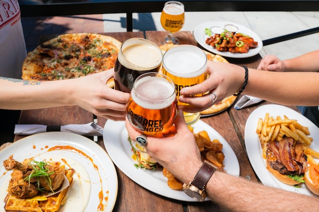 cheers with beers at mexican restaurant