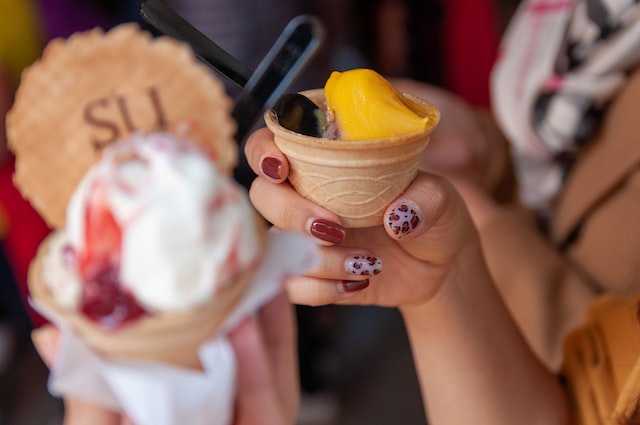 woman holding gelato cone with wafer