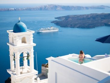 girl in hotel pool in Santorini Greece