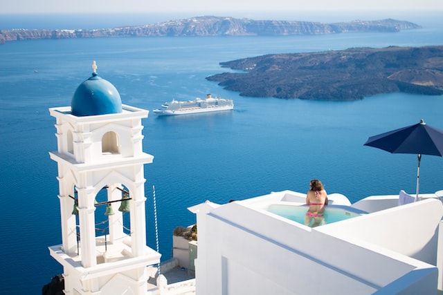 girl in hotel pool in Santorini Greece